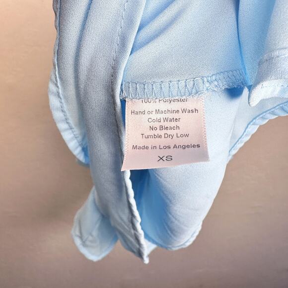 Lucy in The Sky Secret Crush Sleeveless Pleated Tie Waist Romper Sky Blue XS - Picture 13 of 14